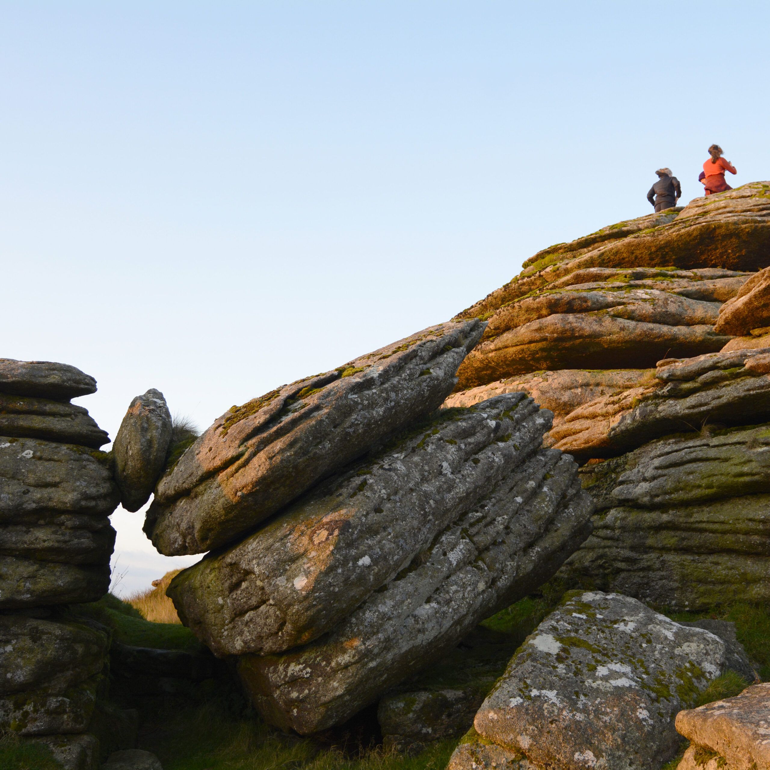 national park hill with rocks and hikers