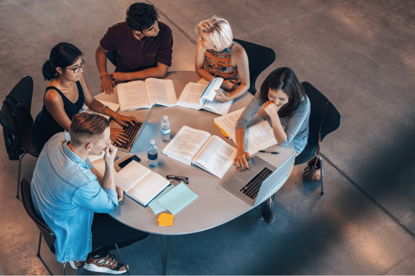 Social Mobility Foundation case study stuydents round a table Eastside People