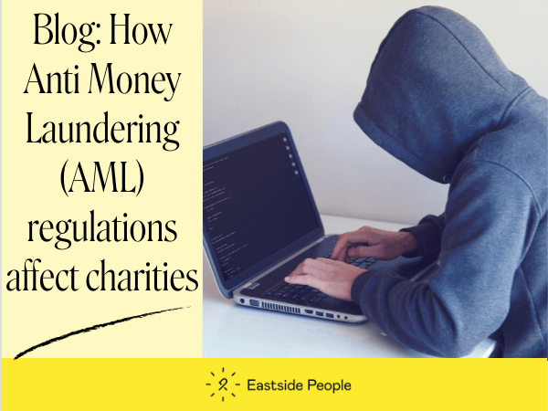 Blog Anti Money Laundering Simon Hinks Website post suspicious person in hoodie using a laptop
