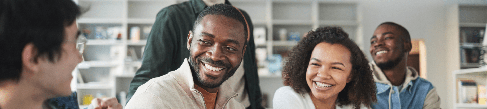 Good Merger Guide website banner 3 of 7 types and models 4 smiling people close up in a line