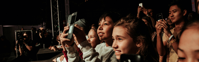 Festival of Trusteeship Blog 2 Live and learn recruiting for lived experience young people at an event taking photos and videos on their phones