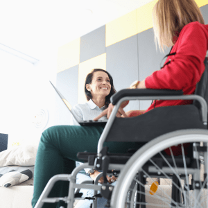 AdviceUK Treasurer person in a wheelchair having a discussion website post