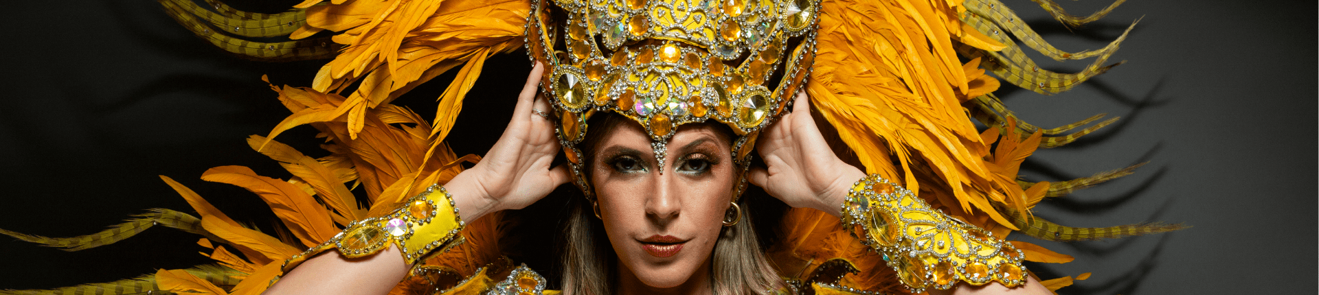 image of a showgirl in gold outfit for festival of trusteeship blog about life of a charity CEO