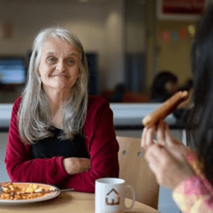 Evolve Housing + Support 2 people having breakfast