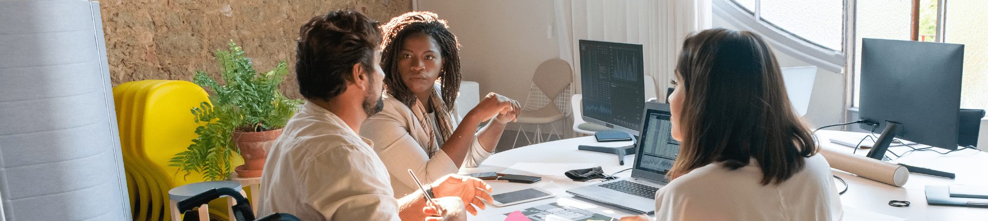 Photo of 3 people 1 in a wheelchair,