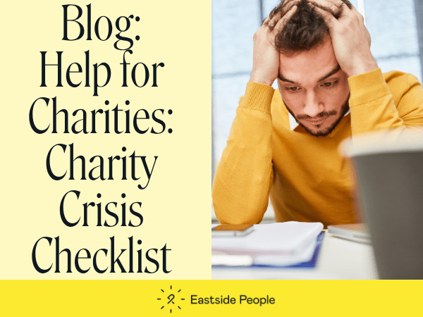 Words Blog Charity Crisis Checklist and a man in a yellow jumper with his hands on his head looking at a paper.