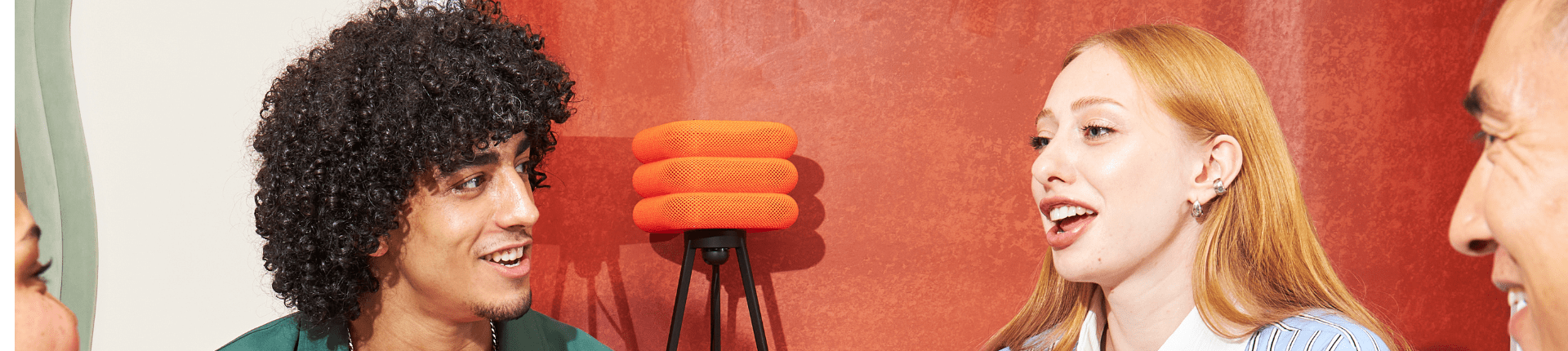 4 people (2 men and 2 women) in conversation