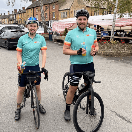 The Eikon Charity two male volunteers bike riding