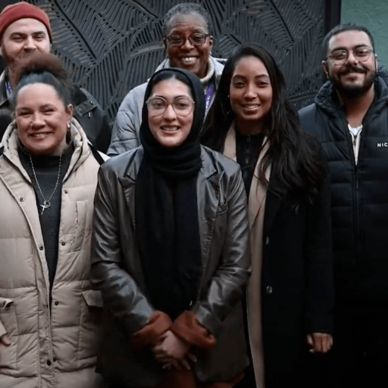 Merton Connected volunteers standing together for a photo outside wearing coats