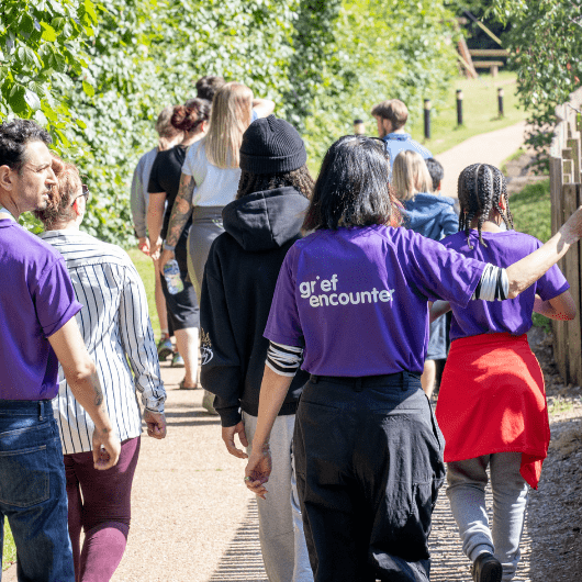Grief Encounter volunteers walking on a day out