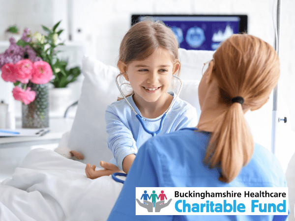 Buckinghamshire Healthcare Charity merger due diligence & interim finance manager (600 x 450 px). Child in a hospital bed talking to a nurse.