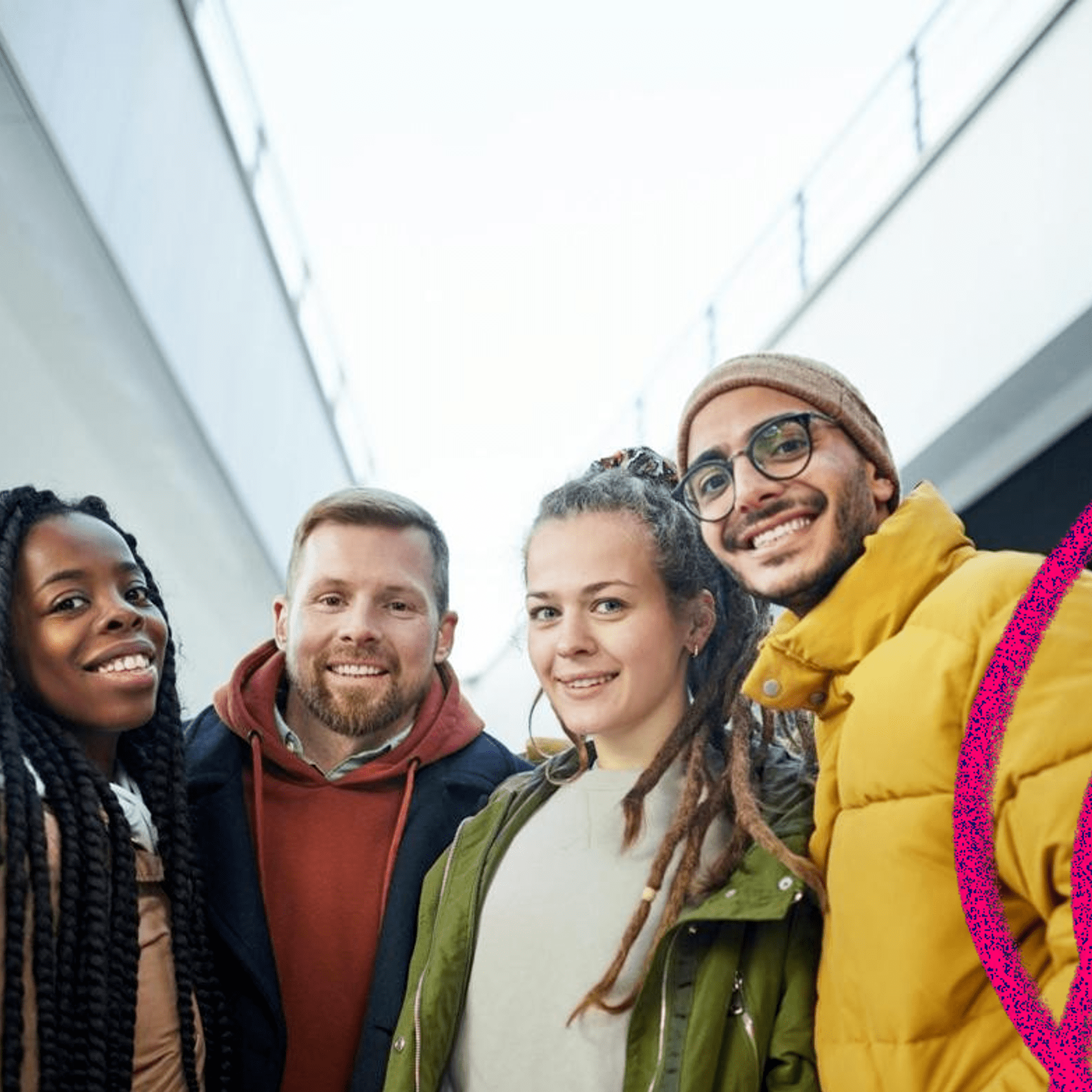 Rochdale and District Mind volunteers, 2 women and 2 men smiling wearing outdoor coats