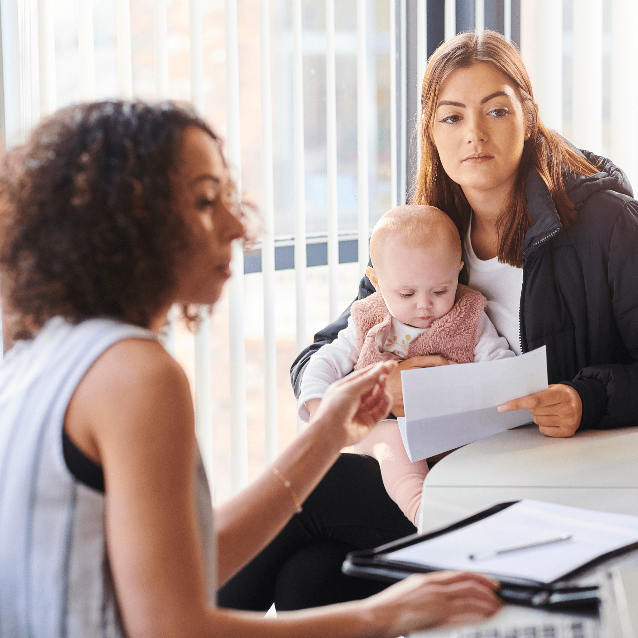 Young mother with support worker Citizens Advice charity in Greater Manchester
