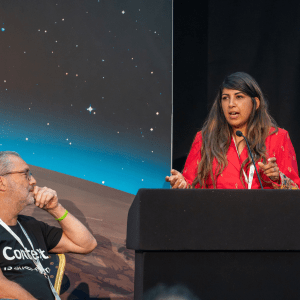 Association for Family and Systemic Psychotherapy female Chair Parveen pictured at an event she is speaking at.